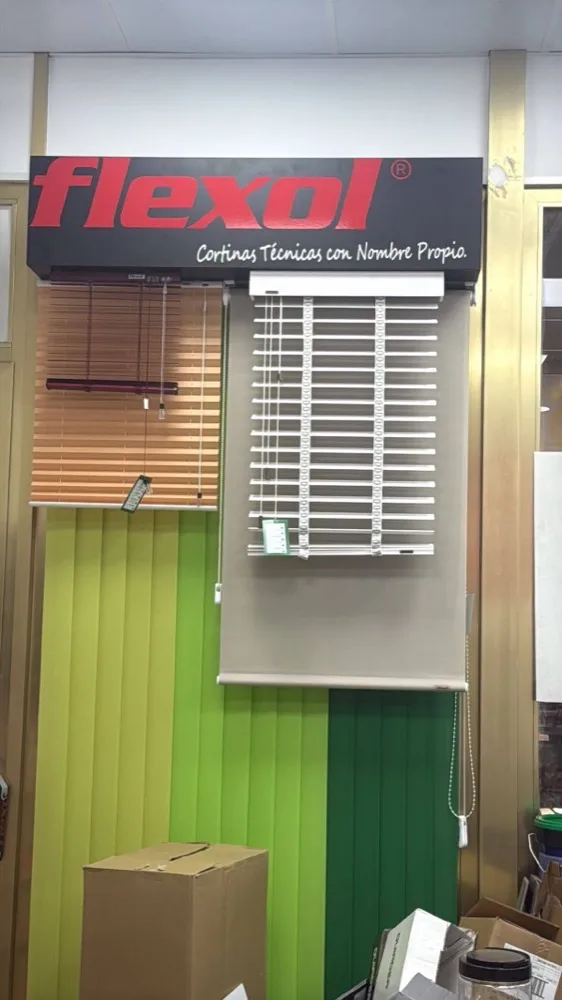 The Flexol display: a white venetian blind and a green vertical blind hung under the Flexol sign.